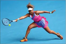  ?? ?? Naomi Osaka stretches to return a shot during her victory over Camila Osorio at the Australian Open yesterday