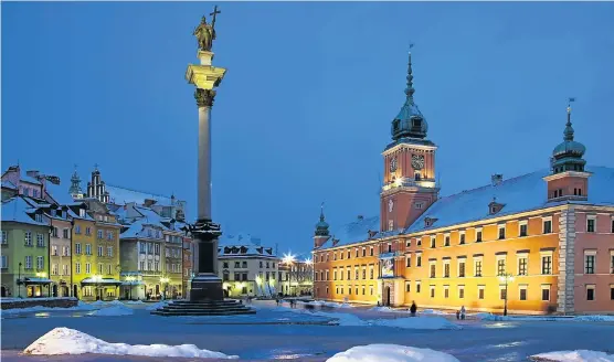  ?? Picture: GETTY IMAGES ?? WARMTH OF WARSAW: Night falls on Castle Square in Warsaw, capital of Poland, which is one of the hottest investment destinatio­ns in Eastern Europe
