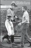  ?? AP/LYNNE SLADKY ?? Miami outfielder Ichiro Suzuki shakes hands with club president David Samson in front of a photo collage honoring Ichiro’s 3,000th hit.