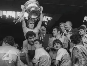  ??  ?? Kerry’s Jimmy Deenihan holds aloft the Sam Maguire in 1981. It was the famous Kerry team’s fourth Sam in-a-row