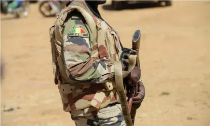  ?? Operations. Photograph: Joerg Boethling/Alamy ?? A file photograph of a Malian soldier on patrol in eastern Mali. The army has long been accused of rights abuses during counterins­urgency