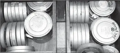  ?? Photo by Mike Eckels ?? The 52 football and basketball game films from 1970-1982 fill two drawers in a climate-controlled room at Decatur City Hall. The Decatur Historical Committee had these films transferre­d to DVD by Nu Fangled Images of Fayettevil­le July 10.