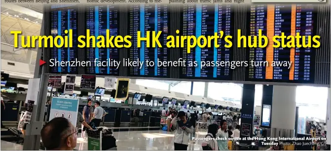  ?? Photo: Zhao Juecheng/GT ?? Passengers check screen at the Hong Kong Internatio­nal Airport on Tuesday