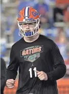  ?? PHELAN M. EBENHACK/AP ?? Florida quarterbac­k Kyle Trask warms up before Saturday’s game against Arkansas.