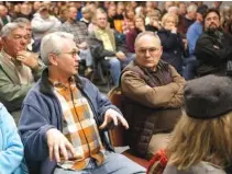  ?? STAFF PHOTO BY C.B. SCHMELTER ?? Former TVA engineer John C. Biggs, left, speaks during a meeting at the Highway 58 Volunteer Fire Department Bob Scott Training Center on Monday in Ooltewah.