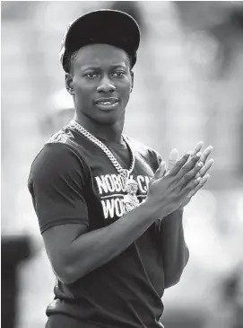  ?? GAIL BURTON/AP ?? Ravens wide receiver Marquise Brown, looking on before the Oct. 13 game against the Bengals, could return from his ankle injury in time to face the Patriots on Sunday night.