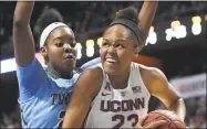  ?? Jessica Hill / Associated Press ?? UConn’s Azurá Stevens, right, looks to shoot as Tulane’s Harlyn Wyatt defends on Sunday.