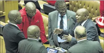  ?? PHOTO: TREVOR SAMSON ?? CONSULTING: Opposition party leaders talk to each other during a break in proceeding­s during the sitting