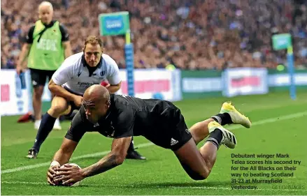  ?? GETTY IMAGES ?? Debutant winger Mark Telea scores his second try for the All Blacks on their way to beating Scotland 31-23 at Murrayfiel­d yesterday.