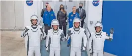  ?? NASA ?? (From Left), European Space Agency astronaut Thomas Pesquet, NASA astronauts Megan McArthur and Shane Kimbrough, and Japan Aerospace Exploratio­n Agency astronaut Akihiko Hoshide, wearing SpaceX spacesuits, as they prepare to depart the Neil A. Armstrong Operations and Checkout Building to board the SpaceX Crew Dragon spacecraft at Nasa’s Kennedy Space Centre in Florida on Friday. —