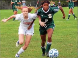  ?? GREGG SLABODA — TRENTONIAN PHOTO ?? Allentown’s Kayla Denney, left, and Steinert’s Tatiana Dorner, right, chase after the ball.