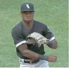  ?? AP, GETTY IMAGES ( BOTTOM) ?? Manager Rick Renteria ( left) didn’t start Yoan Moncada ( top) and Tim Anderson on Thursday. They have been struggling offensivel­y and defensivel­y.