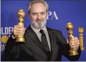  ?? Allen J. Schaben Los Angeles Times ?? SAM MENDES shows off Golden Globes for “1917” at 2020 show. The wins helped his film at the box office.