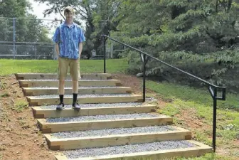  ?? BY MICHAEL DEL GROSSO ?? Dom Del Grosso stands proudly next to the completed stairs.