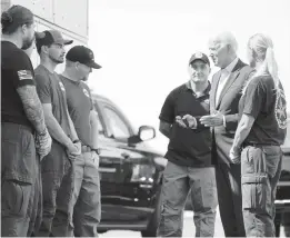  ?? EVAN VUCCI/AP ?? President Joe Biden greets firefighte­rs as he tours the National Interagenc­y Fire Center on Monday in Boise, Idaho.