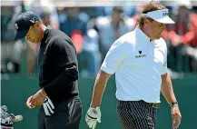  ?? GETTY IMAGES ?? Tiger Woods, left, and Phil Mickelson haven’t always been headed in the same direction during their careers.