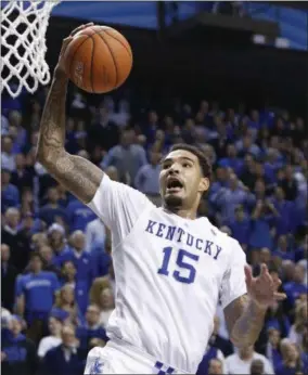  ??  ?? Kentucky’s Willie Cauley-Stein goes up to dunk during the second half on Saturday.