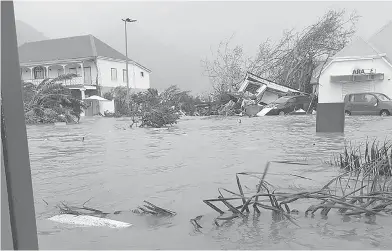  ?? RINSY XIENG / AFP / GETTY IMAGES ?? A picture on the Twitter account of RCI Guadeloupe shows a flooded street on the French island of Saint Martin, after it was hit with high winds from Hurricane Irma.