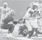  ??  ?? C.E. King’s Jonathan Brantley, right, is brought down in the second half by Crosby’s Joseph Pickney on Friday night.