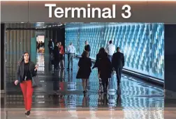  ??  ?? People make their way along the newly renovated North Concourse at John S. McCain III Terminal 3 of Sky Harbor Internatio­nal Airport.