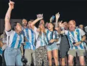  ?? ?? Argentine fans wait for the arrival of their team outside the base camp in Doha.