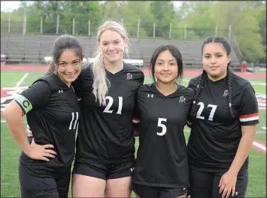  ?? Bennett Horne/McDonald County Press ?? McDonald County High School honored its soccer seniors following their team’s match against Cassville Tuesday night at Mustang Stadium. This year’s seniors are (from left) Helen Martinez, Lexie Abbott, Amalia Cejudo, Estefany Sanchez and (not pictured) Kadence Elliott.