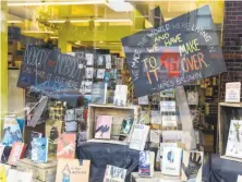  ?? Craig Lee / Special to The Chronicle ?? The window display at Booksmith in the Haight reflects the store’s and the community’s spirit of high-energy activism.