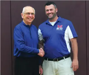  ?? Photo by Ernest A. Brown ?? Richard Lawrence, left, and Ray Leveille shake hands last Wednesday prior to Mount St. Charles taking on East Providence in the Division I boys' volleyball semifinals at East Greenwich High School. Starting this fall, Leveille will be the school's full-time athletic director while Lawrence will be known as senior athletic director.