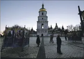  ?? ?? PEOPLE VISIT St. Sophia Cathedral square in Kyiv. President Volodymyr Zelensky on Friday hailed a “historic day” as troops began to retake Kherson city.