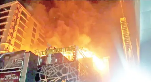  ?? — Reuters photo ?? Fire rages at the multi-storey building in Mumbai, India.