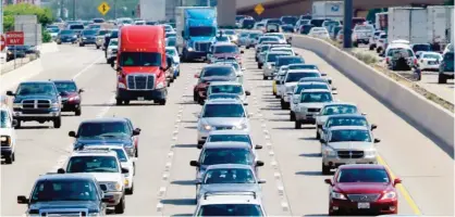  ?? —AP ?? BIRMINGHAM: Drivers work their way out of Dallas during rush hour. Motorists in parts of the country could pay a little more for gasoline in coming days because of the shutdown of a leaking pipeline in Alabama.