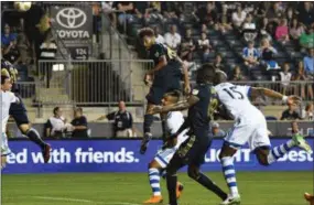  ?? MIKEY REEVES — FOR DIGITAL FIRST MEDIA ?? Media native Auston Trusty heads home his first profession­al goal in the 11th minute, but it was the only tally for the Philadelph­ia Union in a 4-1 loss to Montreal Saturday night.