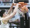  ?? MICHAEL CONROY/AP ?? Purdue center Zach Edey gets a basket on a dunk against Michigan State during the first half on Sunday.