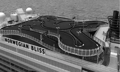  ?? COURTESY OF NORWEGIAN CRUISE LINE ?? A computer image shows the go-kart track aboard Norwegian Bliss, which will sail in November. The ship also features an open-air laser-tag course.