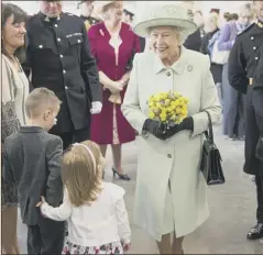  ??  ?? The Queen meets service personnel and their families