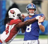  ?? Adam Hunger / Associated Press ?? Cardinals linebacker Markus Golden knocks the ball away from Giants quarterbac­k Daniel Jones on Dec. 13.