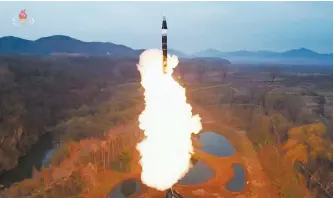  ?? Yonhap ?? Pyongyang’s state-run Korean Central TV shows a test launch of a new medium- to long-range solid-fuel ballistic missile, April 2.