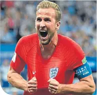  ??  ?? Harry Kane celebrates his winner against Tunisia