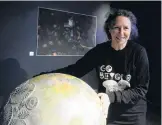  ?? PHOTO: LINDA ROBERTSON ?? Treasure trove . . . ‘‘Art + Oceans’’ exhibition cocurator Pam McKinlay at the Otago Museum with a sculpture of a coccolitho­phore.