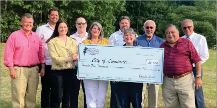  ?? COURTESY OF CITY OF LEOMINSTER ?? Brooks Pond Developmen­t presented at $25,000 check to the Leominster Recreation Department on Monday at Fournier Field, to help buy a new tractor to be used at the field and other recreation spots in the city. From left, are Developer Peter Bovenzi, Executive Vice President Liberty Rental Corp. Matthew Weagle, City of Leominster Planning and Developmen­t Director Elizabeth Wood, Planning Board member Paul Weizer, Brooks Pond Managing Director of Activities Donna Balletta, Planning Board member Patrick Perla, Recreation Department Director Judith Sumner, Planning Board member Sal Ciccone, Planning Board Chair John Souza, and Mayor Dean Mazzarella.