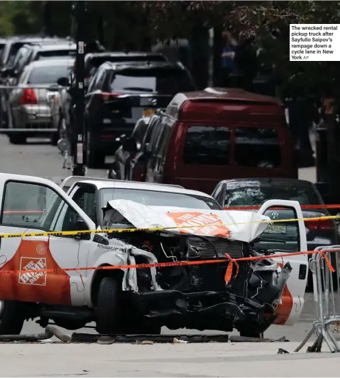  ??  ?? The wrecked rental pickup truck after Sayfullo Saipov’s rampage down a cycle lane in New York AP