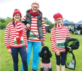  ??  ?? (Left) The Where’s Wally Clan, from left, Jannet Keily, Glen Griffiths, Gretchen Creighton and Bonnie the dog took home one of the many prizes that were on offer during the dress up competitio­n at the Geoff Watt Track on Sunday morning.