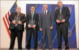  ?? GENE WALSH — DIGITAL FIRST MEDIA ?? Montgomery County District Attorney Kevin Steele presented police officers with commendati­ons during an event in Plymouth Township Thursday. From left are Abington Detective Robert Hill Jr., Pottstown Detective Michael Glauner, Montgomery County...