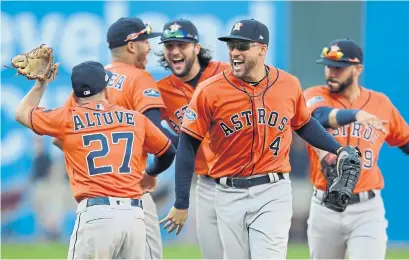  ?? DAVID DERMER THE ASSOCIATED PRESS ?? Houston’s George Springer (4) homered twice on Monday to help the Astros eliminate the Cleveland Indians in a lopsided series.