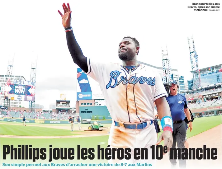  ??  ?? Brandon Phillips, des Braves, après son simple victorieux.