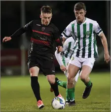  ??  ?? Patrick O’Sullivan of Wexford FC in action against Brandon McCann of Bray Wanderers.