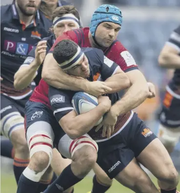  ??  ?? 0 Tadhg Beirne gets to grips with Stuart Mcinally. The Munster man has been criticised for diving.