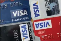  ?? THE ASSOCIATED PRESS ?? Payment processing giant Visa is launching a platform to allow banks to integrate various types of biometrics, such as your fingerprin­t, face, voice, etc., into approving credit card applicatio­ns and payments. It could lead to customers having to take...