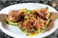  ?? SAM UPSHAW JR./COURIER JOURNAL ?? The Crab Cake with squash succotash served at Mesh