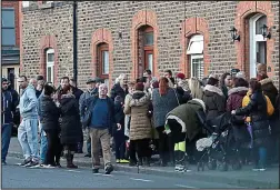  ??  ?? Paying respects: Sympathise­rs in Portland Row yesterday